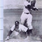 Jack Lindsey as the shortstop throwing the ball.