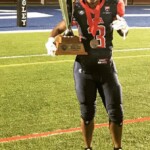 Odessa Jenkins with Womens Football Championship Trophy
